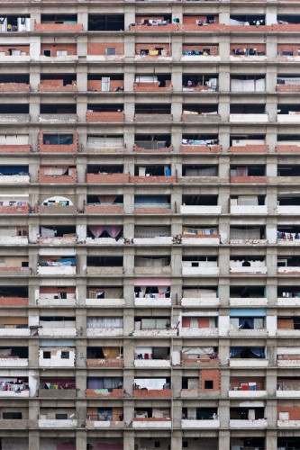 Unfinished commercial tower occupied by squatter community