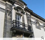 The reharled facade & replicated balcony over the entrance