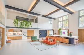 A large kitchen island with a HIMACS worktop forms the bold centrepiece of this spectacular loft
